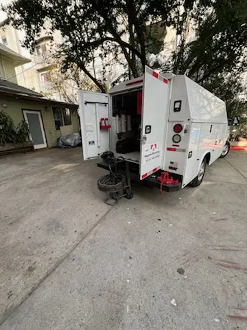 Magnet Plumbing service vehicle on-site for Grease Trap Cleaning in Houston